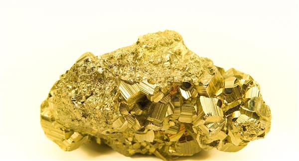 Block of gold rock isolated on white