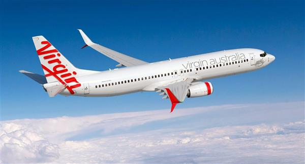 A Virgin Australia plane flies through the clouds.