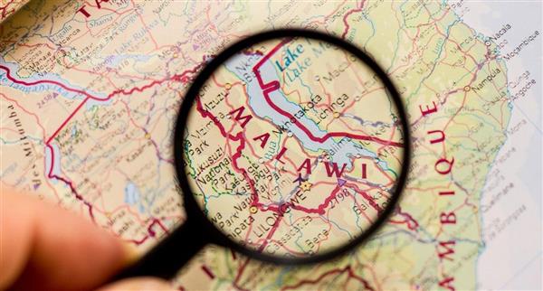 Map of Malawi being looked at through a magnifying glass.