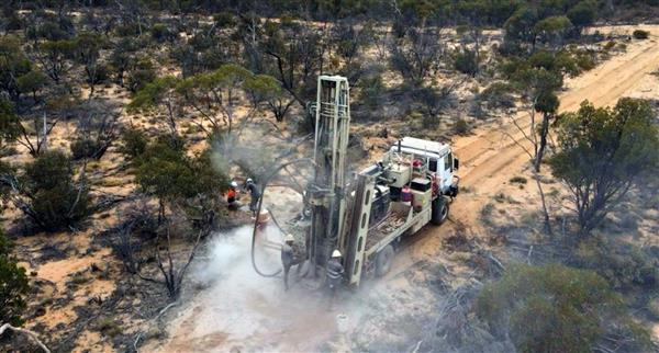 A truck drives through a Metal Hawk mining project.