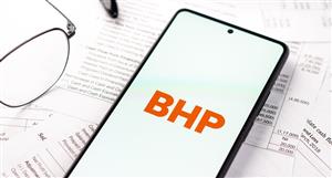 BHP underlying profit down 23% on lower metals demand – and dividend follows