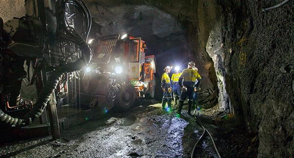 Several miners working in a Sandfire Resources dig site.