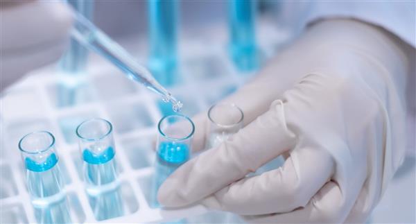 Scientist with a pipette