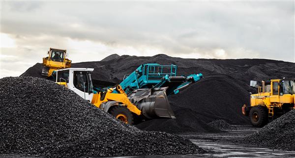 Caterpillar tractors collect black coal pile. Illustration of supply field of power station.